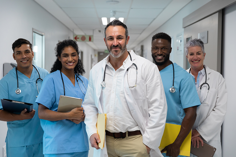Healthcare team standing together in a healthcare facility.