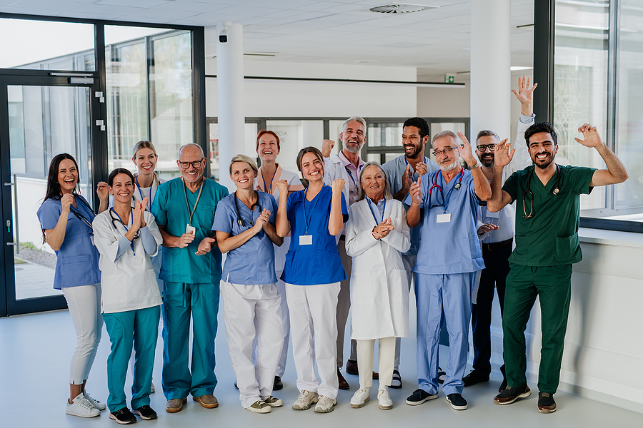 Diverse group photo of medical assistants with doctors and nurses