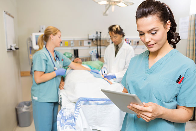 bigstock-Beautiful-nurse-using-digital--53068156.jpg