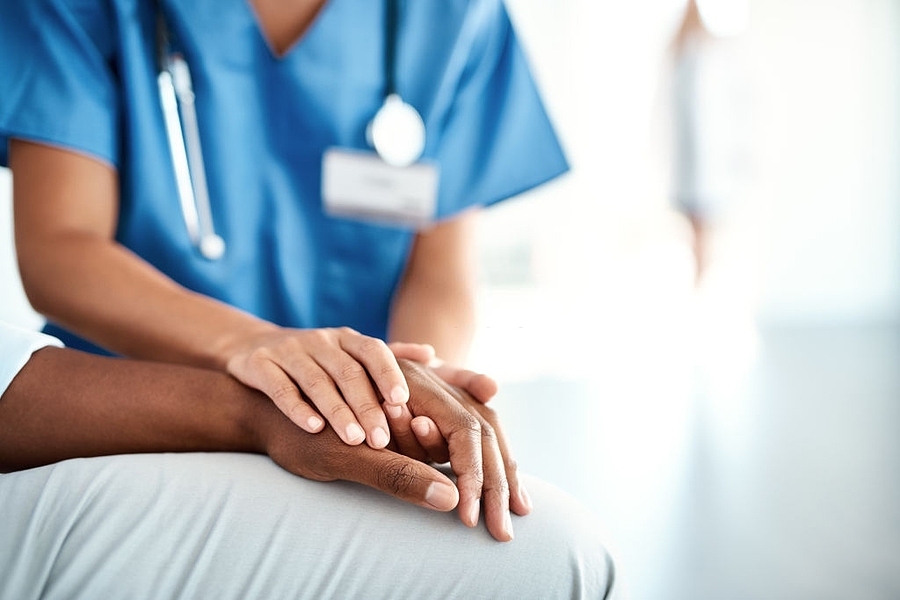 medical assistant works with a patient.