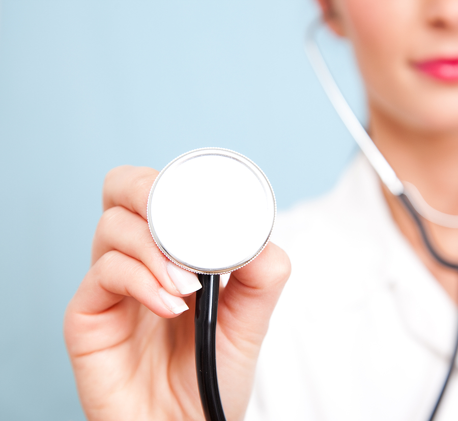 Medical assistant holding a stethoscope