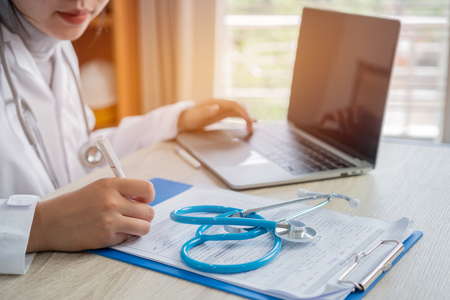bigstock-Medicine-Doctor-Writing-Docume-330908779